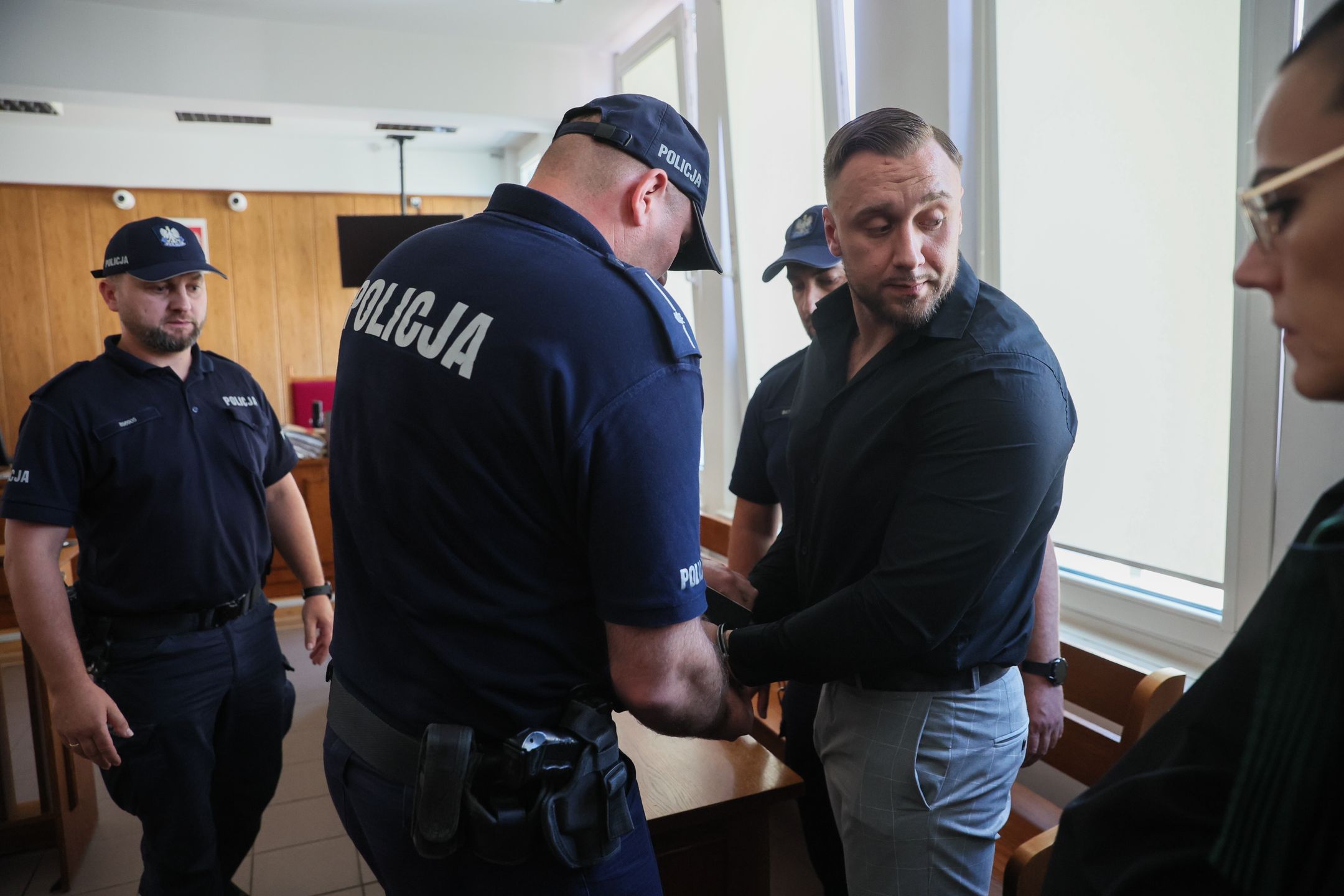 Łukasz Żak usłyszał wyrok. Tak wychodził z sądu